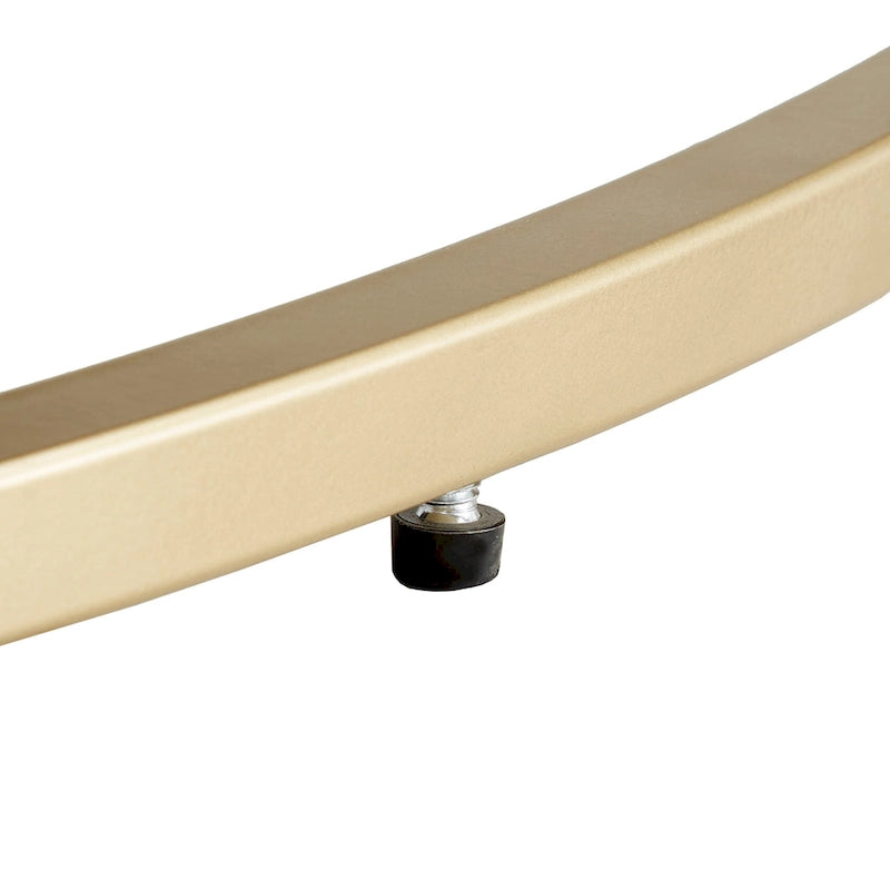 Pouf rond capitonné en velours et finition dorée